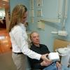 Photo for Dental hygienist explains teeth whitening options at the office of Rolando Cibischino DMD