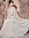 Photo for Creative white wedding wear net designer saree